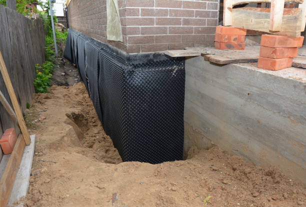 Happy homeowners after waterproofing job in Ridley Park